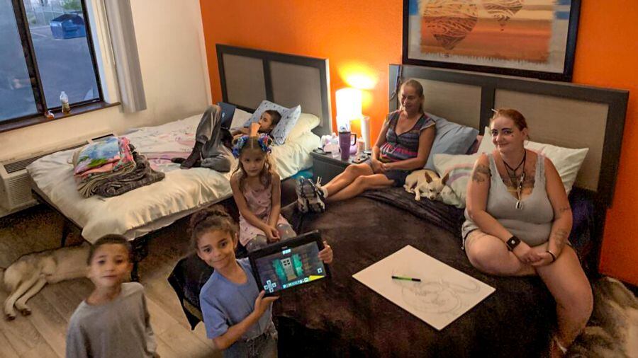 Cree Walker, right, and her family have a Section 8 voucher but have been unable since July to find a landlord who will take it. So they have to cram into this extended-stay hotel room and fear being kicked out any day. Pictured are Walker with mom Renae Simonson, along with Walker’s kids Gabriel, 12, Castiel, 7, Azariah, 6, and Renesmee, 5.